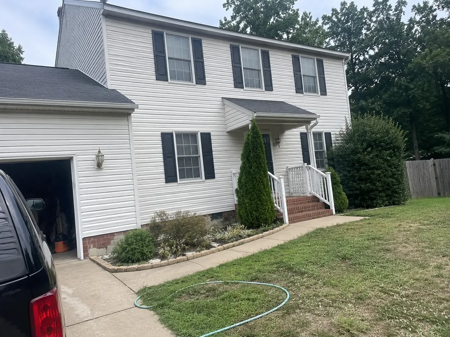 Clean white vinyl siding on a two-story Virginia home after house washing